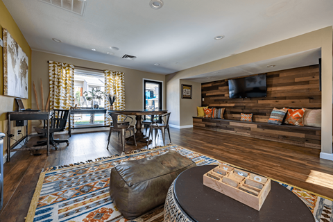 a living room with a couch and a table and a television